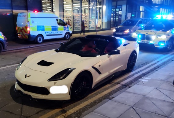 White Corvette stopped by Manchester police.