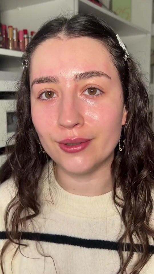 Woman with long brown hair discussing forbidden items at her workplace.