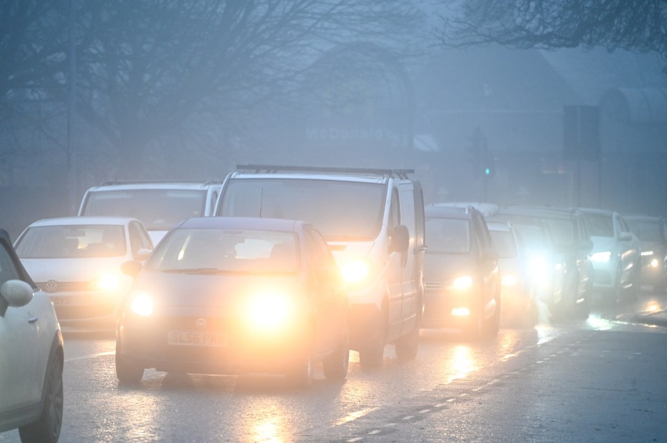 Cars driving in heavy fog.