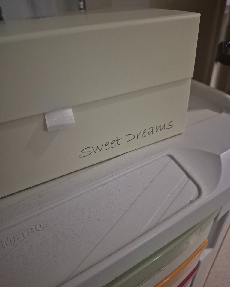 Cream-colored box with "Sweet Dreams" written on it.