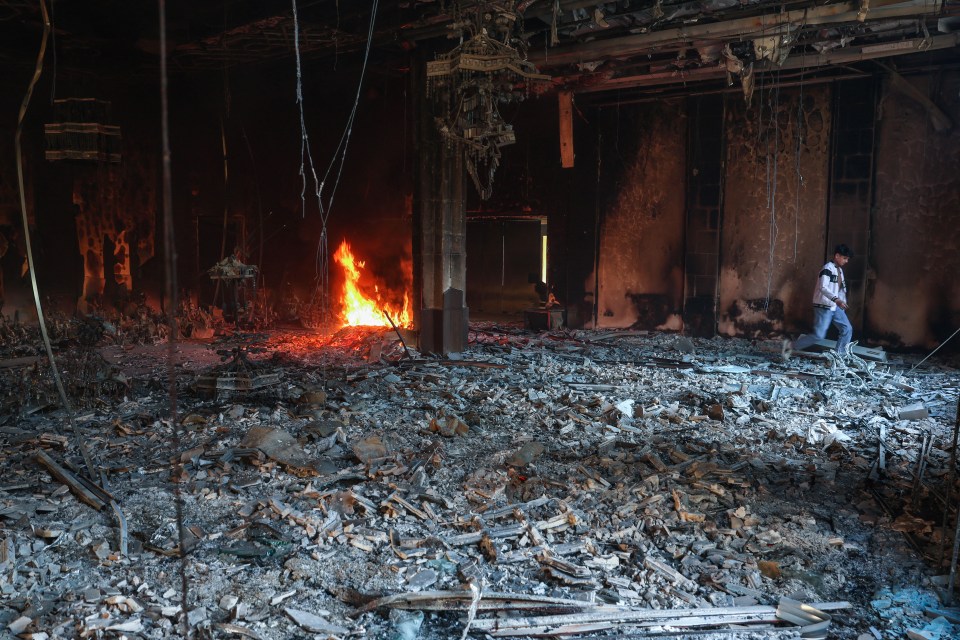 A fire burning in a room of the Tishrin residential palace of Syria’s ousted president in December