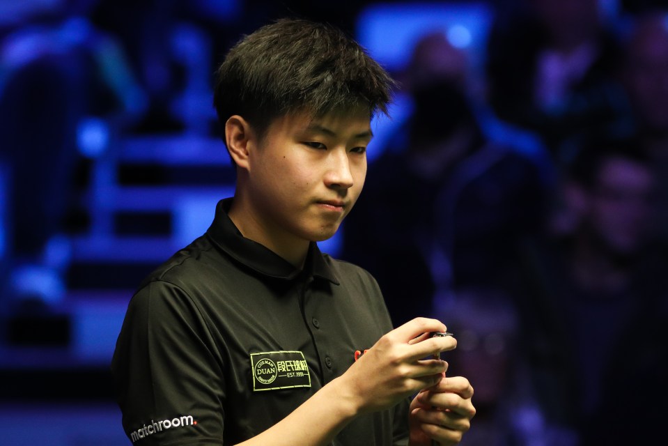 Zhao Xintong of China at a snooker quarter-final match.